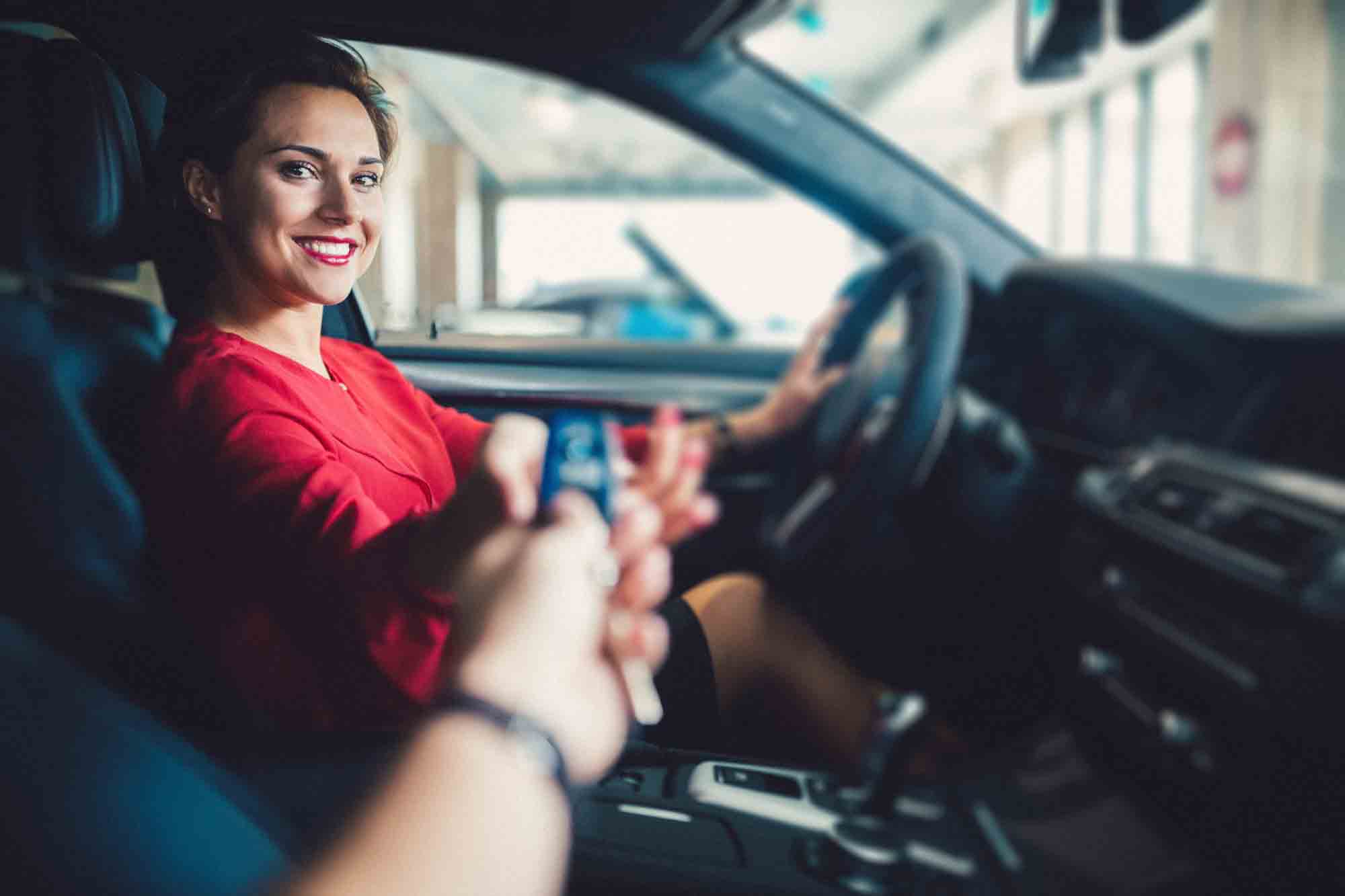 Businesswoman buying luxury car